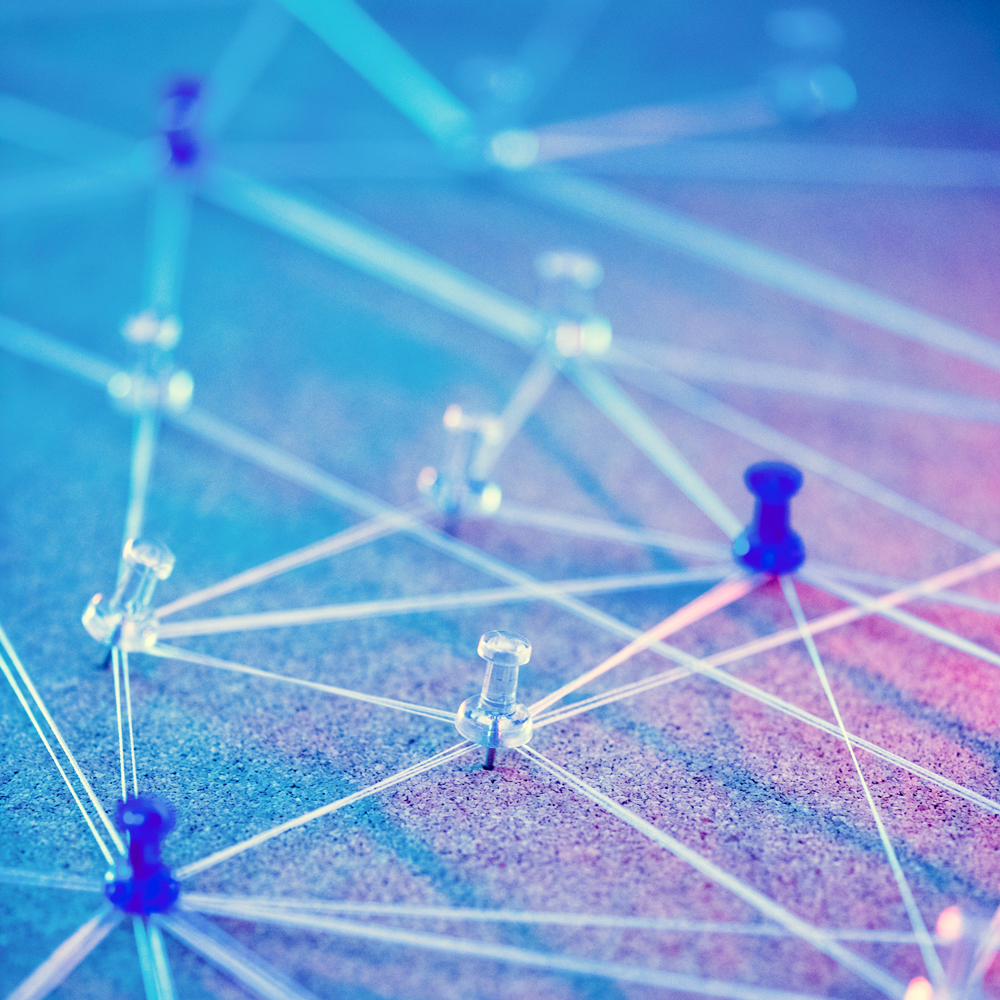 Push pins and string representing an interconnected network with the implementation of a Virtuas Backup Plan.